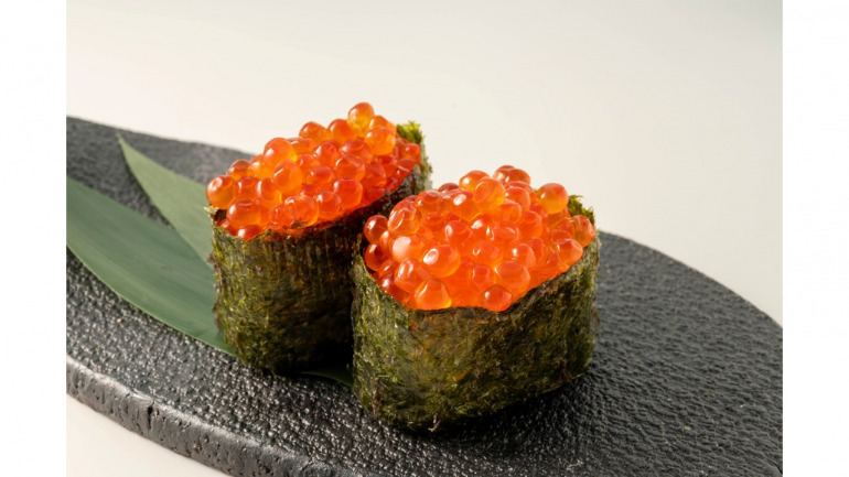 Ikura (salmon roe) gunkan-maki — a signature edomae omakase neta